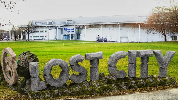 The full sign on the lawn in front of the complex