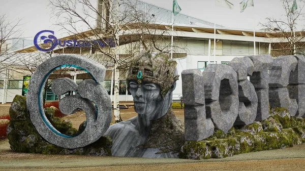 Granite-grey version of the sign in front of the entrance
