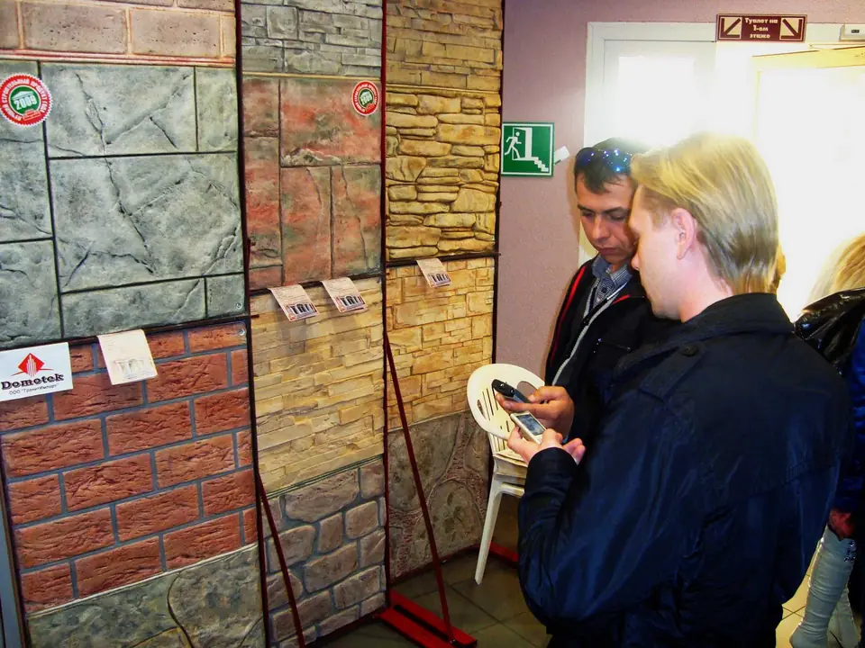 Visitors studying the panel samples