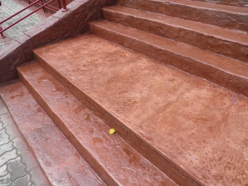 Red-brown steps with a textured tread and a landing