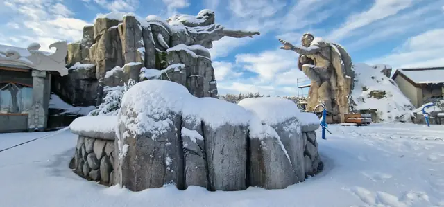 Artificial rockwork in winter, covered in snow