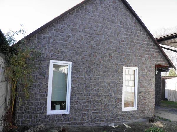 The gable wall with two tall windows