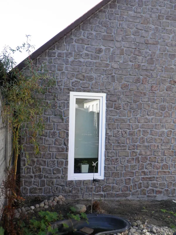 Gable, window and the willow by the fence