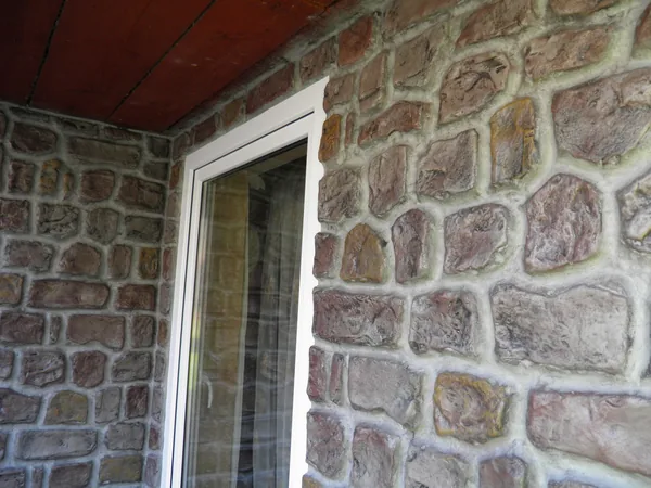 The wall under the corrugated roof