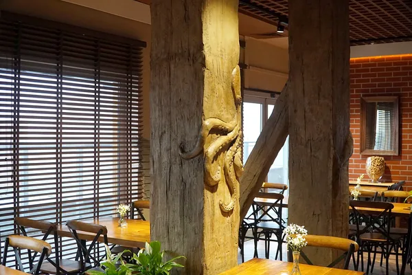 Two columns and the diagonal brace, all in imitation old timber