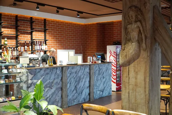 Mermaid column in front of the bar