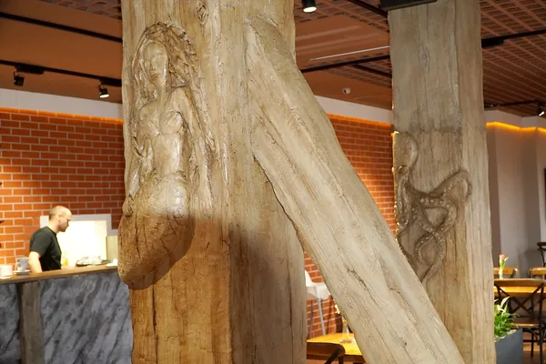 Mermaid column with its diagonal brace, octopus column behind