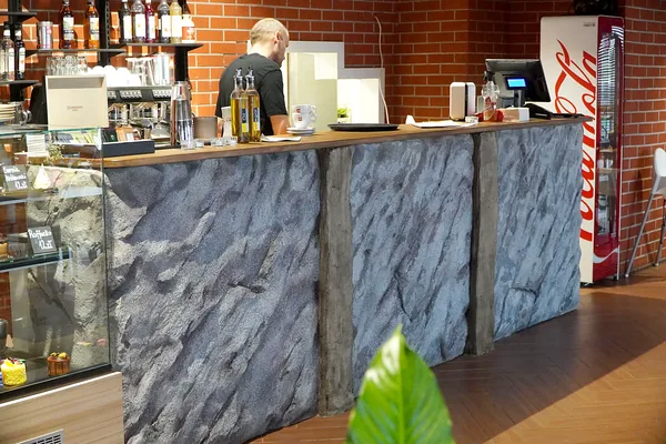 Rock counter beside the cake display