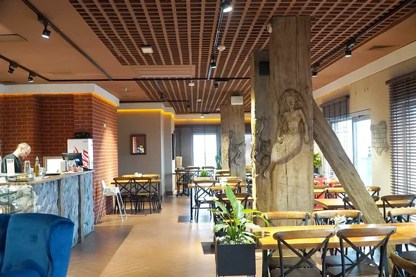 The hall with the mermaid column and brace