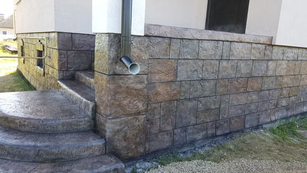 Steps, pillar and the plinth wall of the terrace