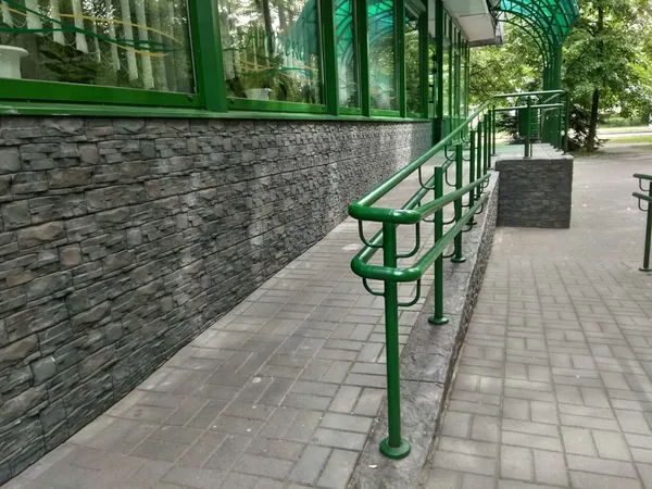 Ramp and plinth wall leading to the main entrance