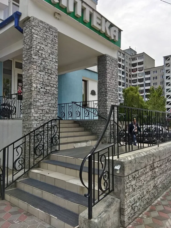 Pillars and stairs of the porch from the pavement