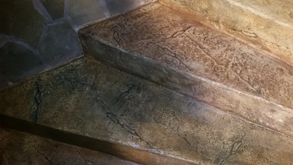 Close-up: stone texture, cracks and colour on two treads
