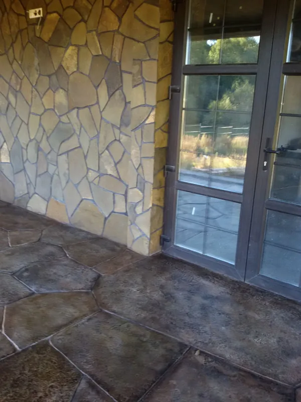 Darker flagstones in front of the glazed terrace doors