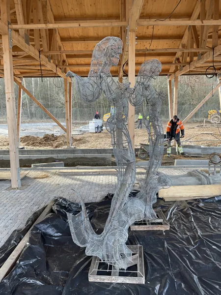 Mermaid figures: steel mesh armatures under the site shelter